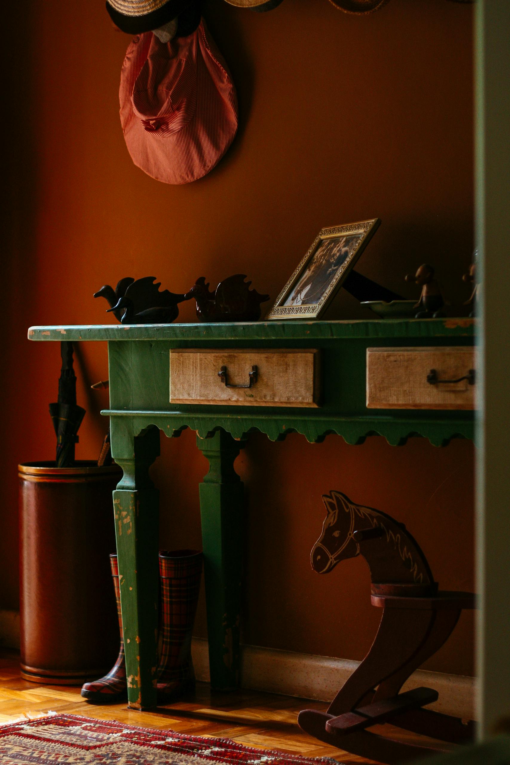 A warm vintage home interior featuring wooden furniture and decor elements.
